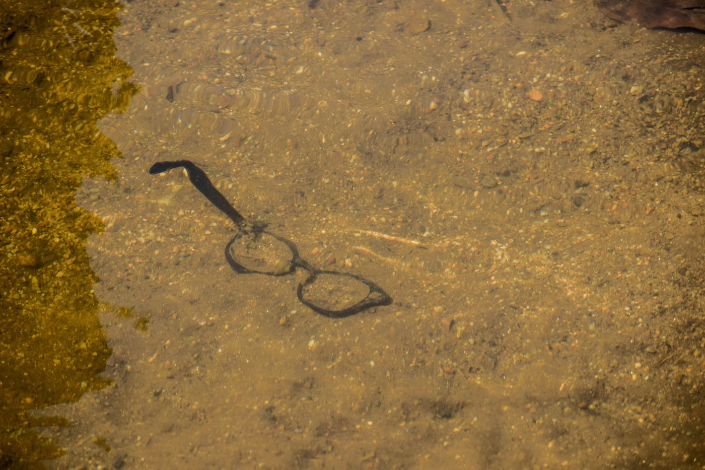 Broken glasses in the river in North Thailand.